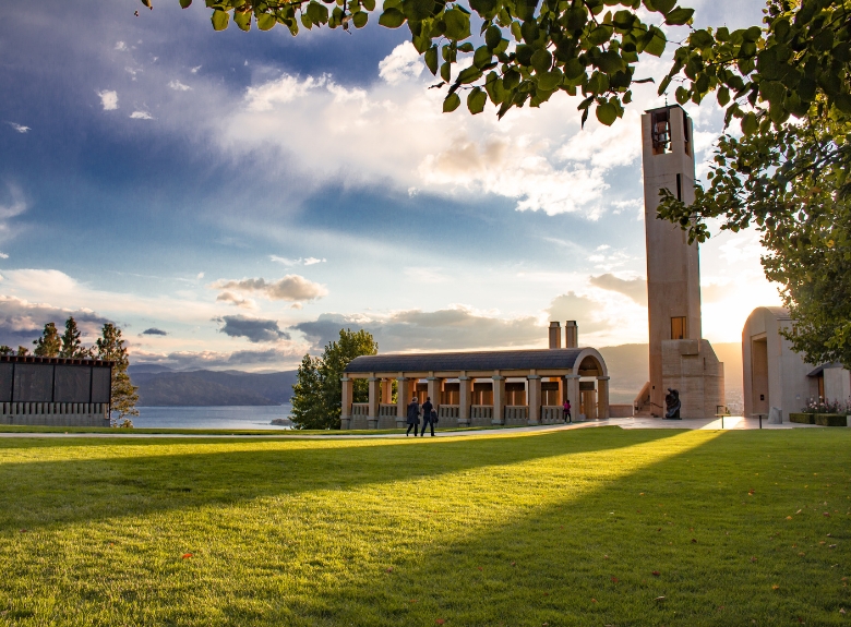 The iconic bell tower and estate grounds at Mission Hill Family Estate Winery overlook Okanagan Lake, showcasing one of the most recognizable winery destinations in West Kelowna.